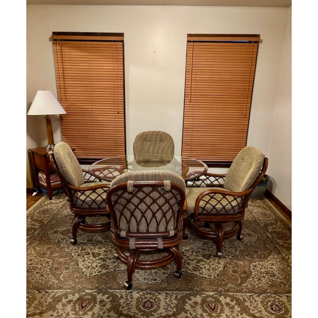 Handcrafted in the USA by Classic Rattan, Inc. of Nicholasville, Kentucky. This high-quality six-piece rattan dining set...
