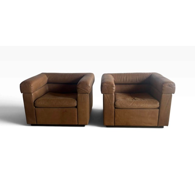 Really fantastic and unusual pair of 1980s brown leather club chairs. Made in New York by Designers Furniture Center....