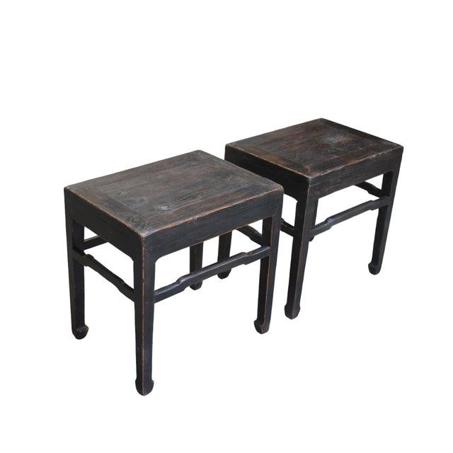 This pair of 19th century side tables feature a minimalist, architectural silhouette characteristic of late Qing Dynasty...