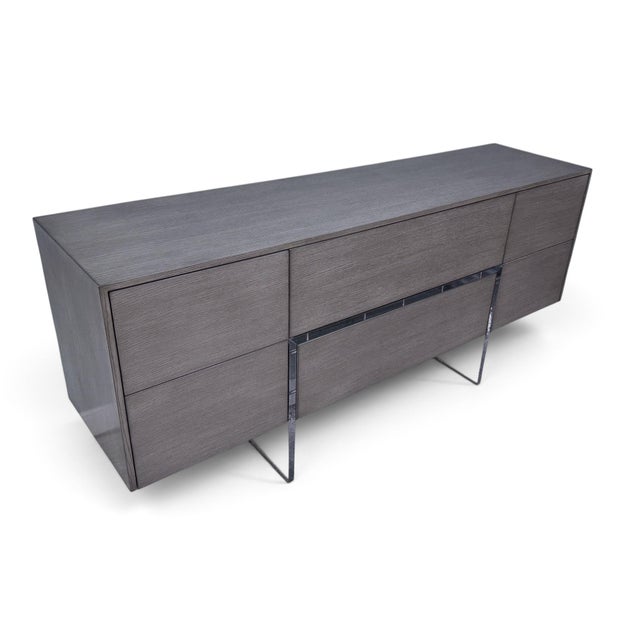 An exceptional Athena 6-drawer dresser by Belle Meade Signature. Features a sleek, modern case supported by acrylic legs...