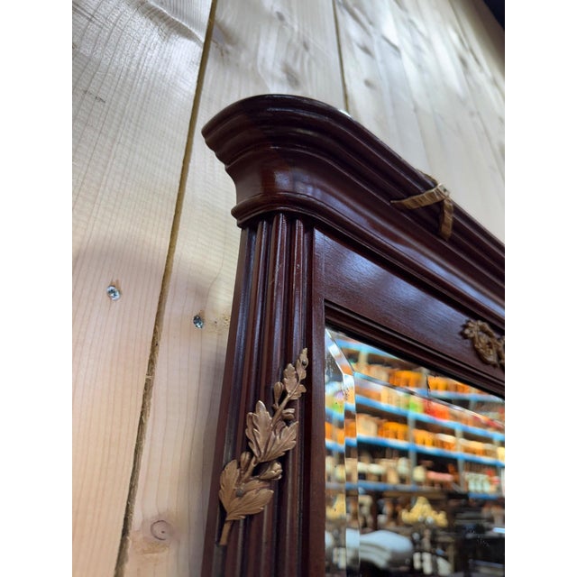 Large Louis XVI style mahogany and gilt mirror. Very good condition.