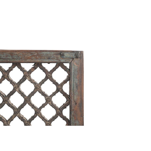 This Vintage Indian Teakwood Jali Window Panel is handcrafted from solid teakwood, featuring a finely constructed diamond-...