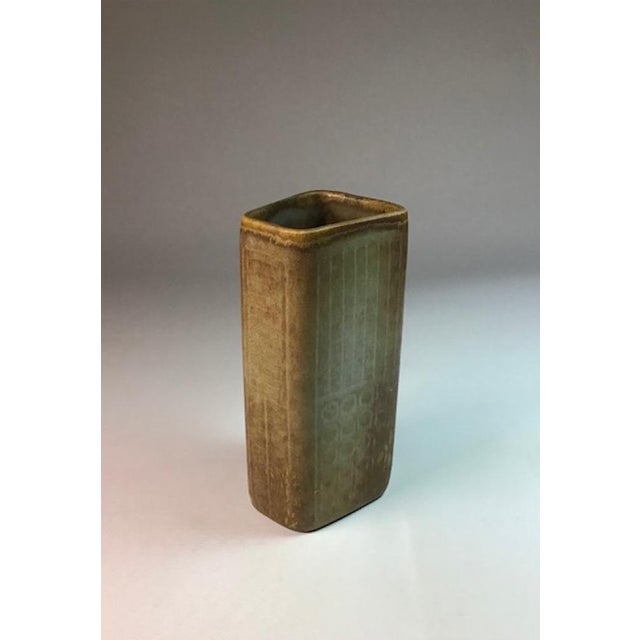 A classic example of Nylund’s stoneware work, featuring an organic form and a velvety brown "hare's fur" glaze. This piece...