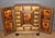 A Swiss walnut cabinet, decorated with landscapes and lively scenes of daily life, opens with two doors decorated on both...
