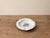 An elegant vintage ashtray in authentic Meissen hard-paste porcelain, featuring a delicate hand-applied blue floral motif...