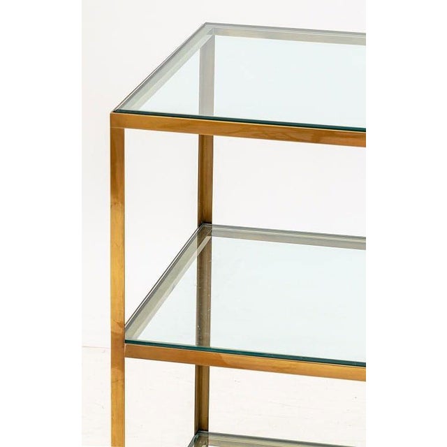 Sophisticated and versatile, this pair of three-tier side tables showcases a refined contemporary take on Mid-Century...