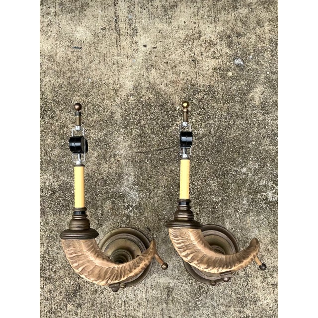 These vintage brass wall sconces bring sculptural mid-century modern character to a room with a pair of gracefully twisted...