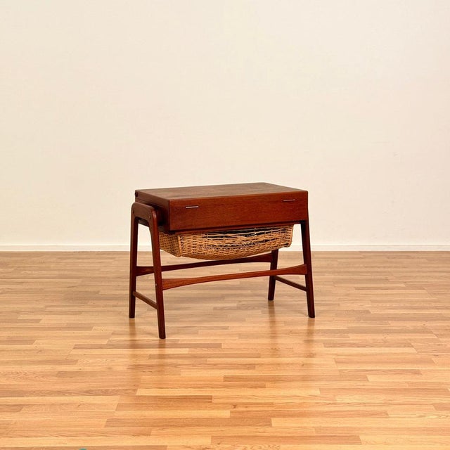 The side table was made in Denmark in the 1950s-60s. It is made of teak wood and veneered on top. The table has been...