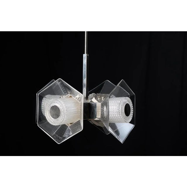 Vintage chrome ceiling light from the 1960s to 1970s. The light is likely Italian and has a frame in chromed metal. Four...