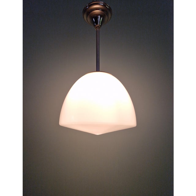 Bauhaus pendant light in white opaline glass and chrome-plated metal, produced by philips (phililite series), 1930s. the...