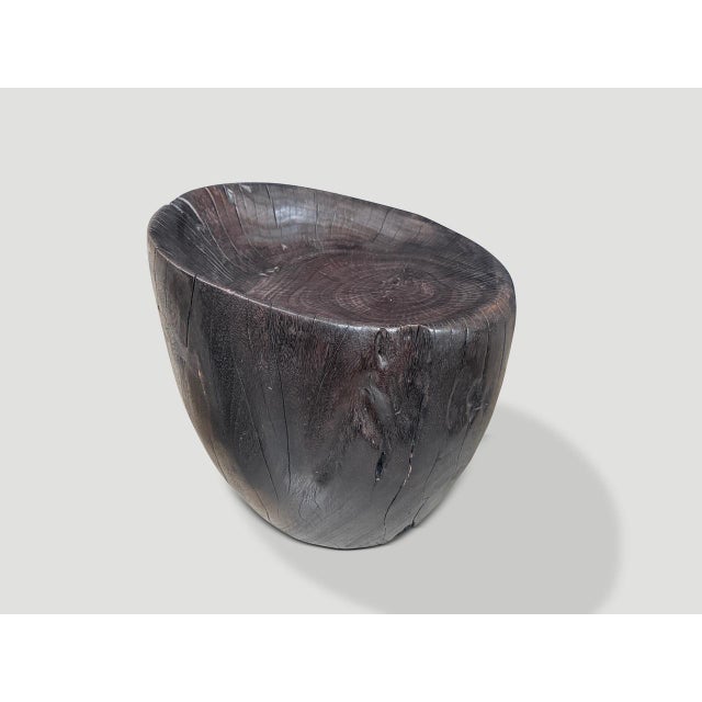 Beautiful chair hand carved from a single block of wood. Charred to an espresso tone revealing the unique wood grain. Both...