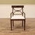 Set of 10 cross-back dining chairs with a dark walnut finish. An AP Exclusive by AntiquePurveyor. These chairs coordinate...