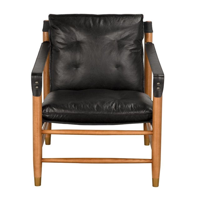 This chair features a Dark Walnut frame paired with Ebony Black leather and canvas details. Its clean lines and material...