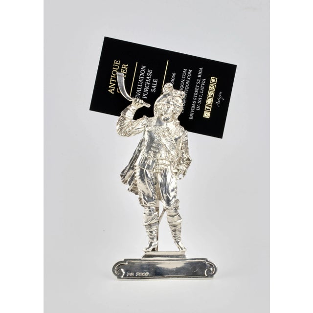 English silver card holder in the shape of a Musketeer blowing a horn. London 1896. 925 sterling silver. H-14cm. Brand of...