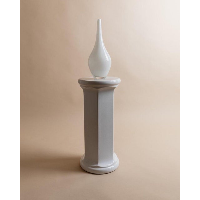 This vintage ceramic flower stand from the 1970s features a timeless design, reminiscent of a classical Greek column. The...