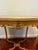 Exceptional French Louis XVI-style occasional table with an ornate carved giltwood frame and striking natural green onyx...