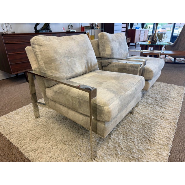 Pair of super comfortable mid century modern style lounge chairs by Arhaus. The polished chrome frames are stunning in...