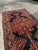 Immerse your space in the artistry and heritage of Persian craftsmanship with this handmade antique Persian Luri wool rug,...