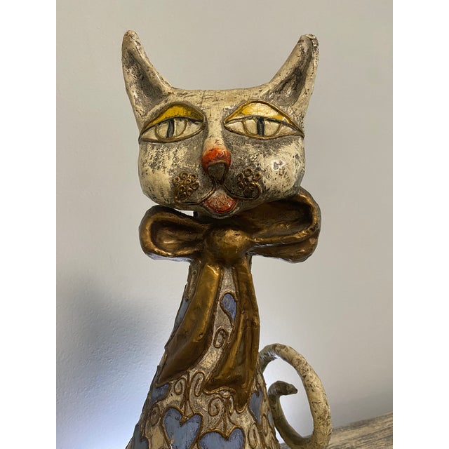 Whimsical vintage seated cat sculpture attributed to Jeanne Valentine, handcrafted from papier-mâché and finished in...
