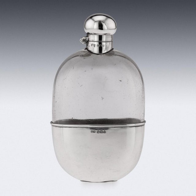 Antique early-20th Century Edwardian solid silver and glass mounted hip flask, with silver hinged screw top and removable...