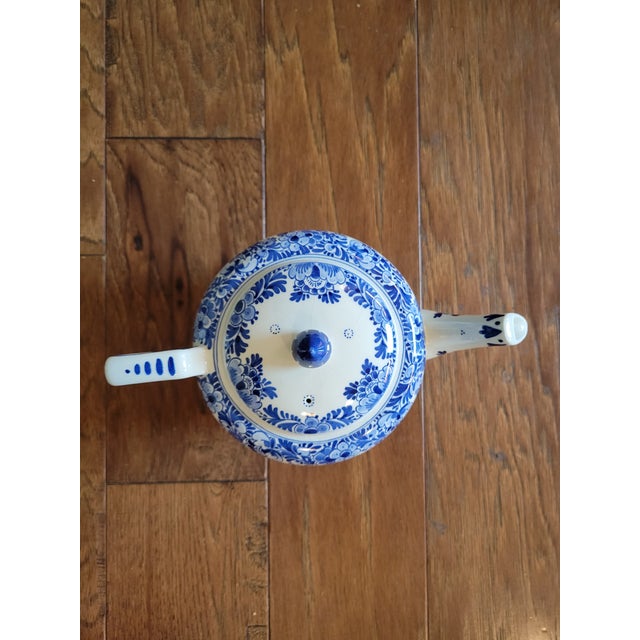 This beautiful hand painted delft teapot by Royal Delft is crazed throughout, but appropriate for display.