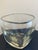 Elevate your home with this stunning, hand-formed glass bowl. Crafted from thick, clear glass, this piece features a...