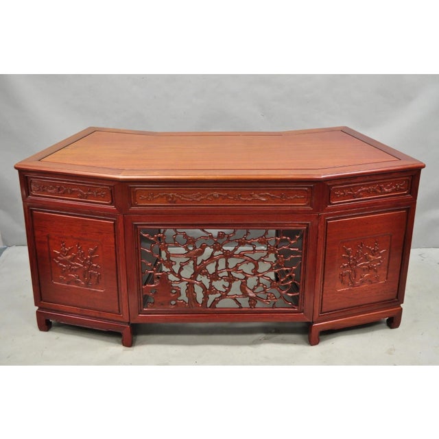 Vintage Chinese Bird Carved Hardwood Kneehole Writing Desk with Decorated Back. Item features a unique angled design with...