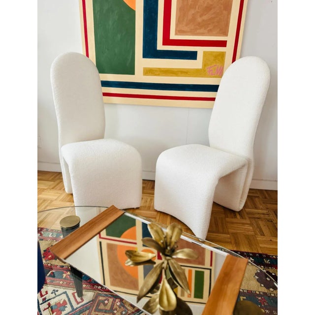 Original pair of Etcetera high back armchairs attributed to Jan Ekselius with his signature curved seat and back are newly...