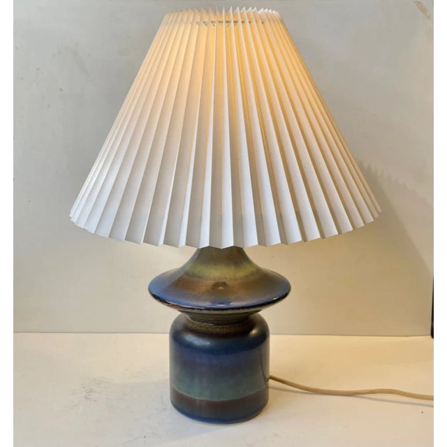 Danish diablo shaped pottery table lamp with a rainbow of multiple glazes similar to the techniques popularized by Bernt...