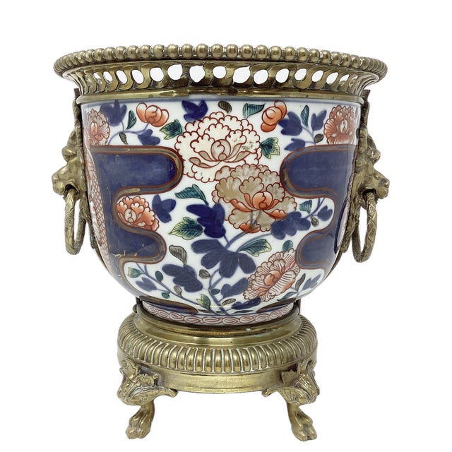 19th C Imari porcelain cachepot mounted in brass with lion's head handles. This is a beautiful addition to your Imari...