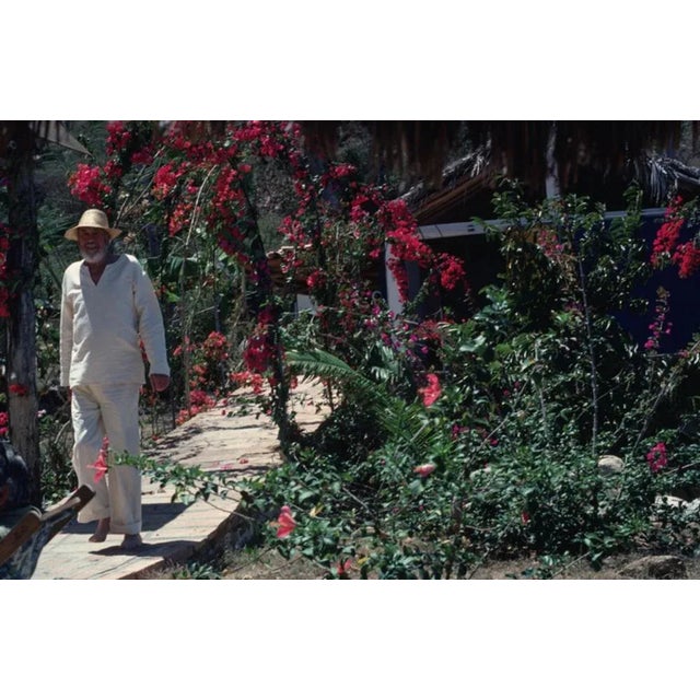 John Huston 1979 by Slim Aarons Slim Aarons Limited Estate Edition April 1979: American film director John Huston walking...