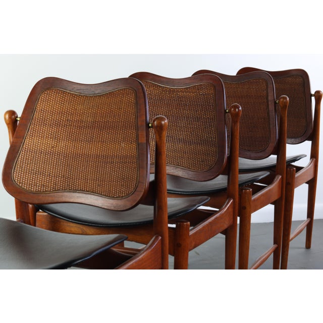Mid Century Modern dining chairs in solid wood with wonderful details, garaunteeing attention from any angle.