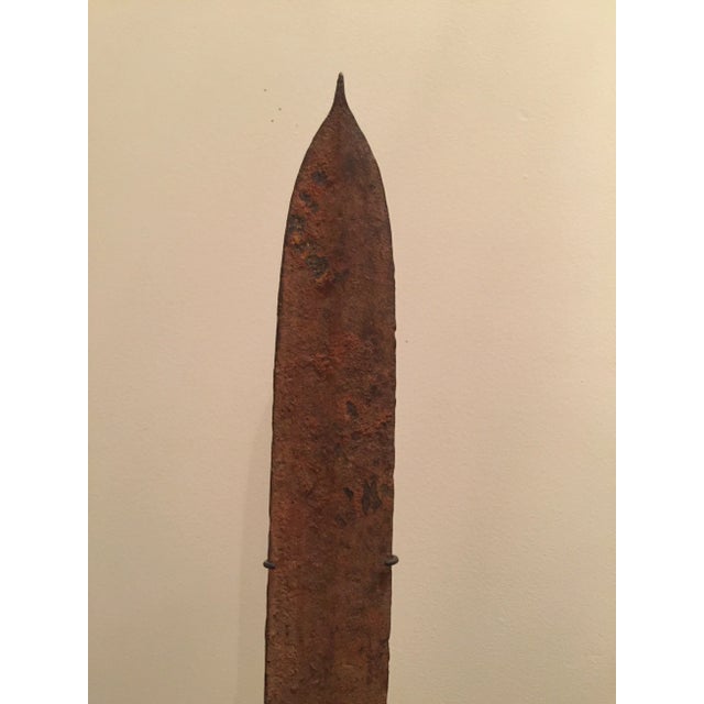 From the former kingdom of Zaire, this iron forged piece served as a means of trade among the Topoke people. Blacksmiths...