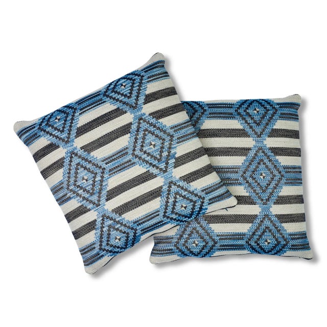 This 22" x 22" pillow features Manta Performance in Blue. A layered geometric inspired by indigenous motifs, this high...