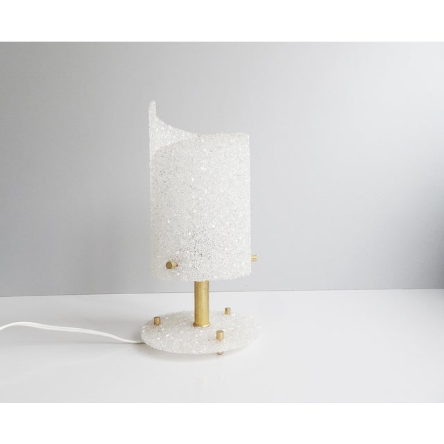 This French lamp is a noble table lamp from the 1960s. Beautifully shaped design made of resin / resin with gold details...