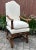 Louis XIV Walnut Mutton Bone Armchair, early 18th century, having an arched crestrail, upholstered back, loose seat...