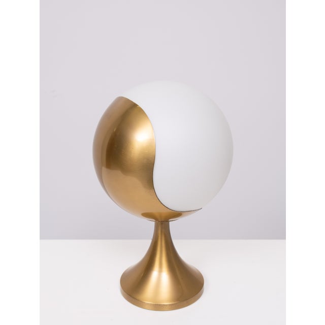 Eclipse.‎ A lamp designed with soft pleasant lines consisting of a light sphere supported by a 360° swivel support...