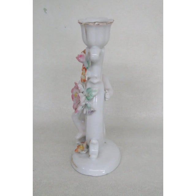 This lovely Candle Holder is made of Porcelain. This Floral themed candle holder features a very classic depiction of the...