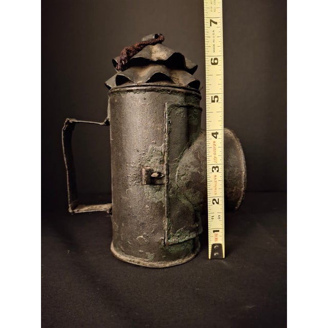 Offered is a scarce, early-to-mid 19th-century (c. 1830s–1860s) sheet iron ("toleware") bullseye candle lantern. Unlike...