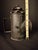 Offered is a scarce, early-to-mid 19th-century (c. 1830s–1860s) sheet iron ("toleware") bullseye candle lantern. Unlike...