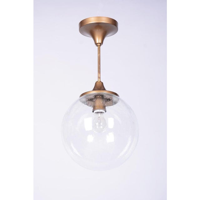 This elegant pendant chandelier originates from the 1960s Czechoslovak design environment and is a typical representative...