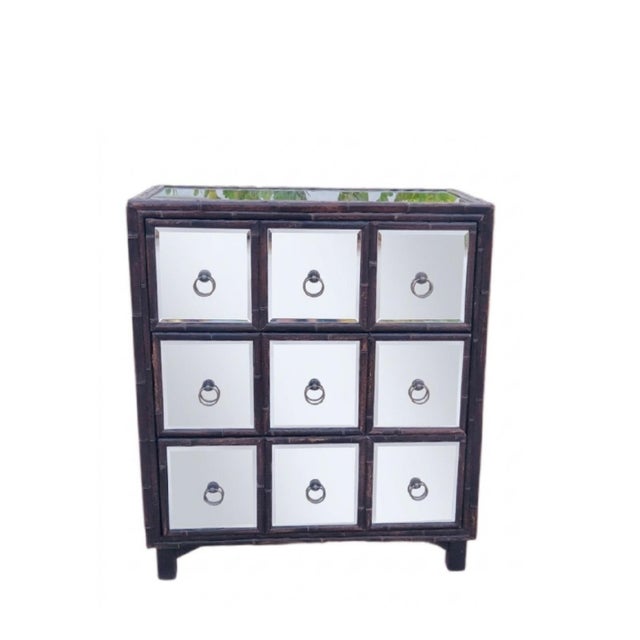 A beautiful 3 drawer all mirrored Dorothy Draper style chest of drawers. The chest appears to have 9 separate smaller...