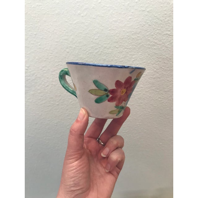 Although these hand made cups are a set, each one is just a little different. All are marked Italy on the bottom.