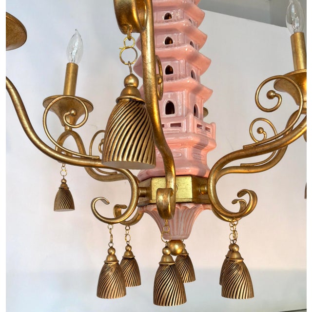 Original retail $1635, stylish Port 68 Pink Ceramic Pagoda Chandelier, gold frame and accents, showroom floor sample