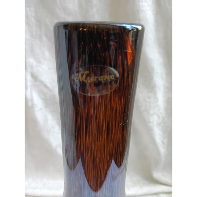 Elevate your space with this stunning vintage Murano art glass bottle vase. Blown in a rich, warm amber brown tone, this...