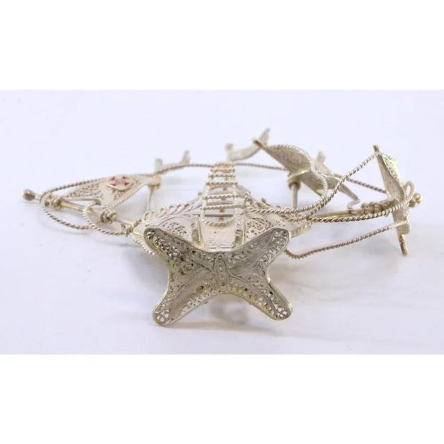 Small Silver Filigree Caravel with Enamelled Crosses, in Very Good conditions. Designed 1980 to 1989 This piece has an...
