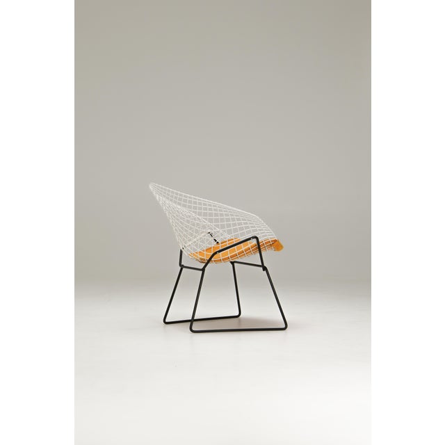 The Diamond Chair is part of Bertoia’s 1952 wire collection for Knoll International. The shell is formed from bent and...