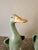 A charming pair of vintage Chinese celadon glazed ducks, modeled as mirror images so they face each other when displayed....