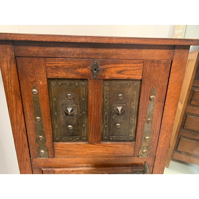 "Brutalist Art" Oak and metal-plated secretary desk One door and drop-front Hammered metal plate design Paneled sides Good...