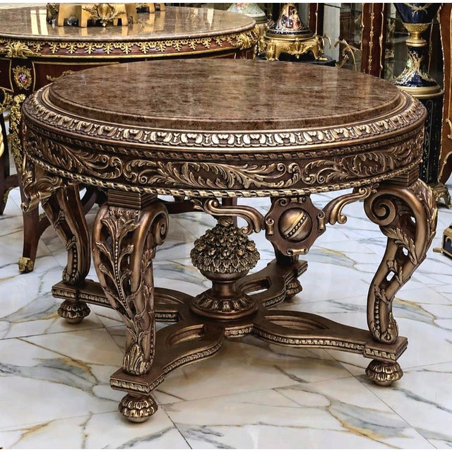 Make a dramatic statement with this grand, substantial French-style center table, designed with an exceptionally ornate...